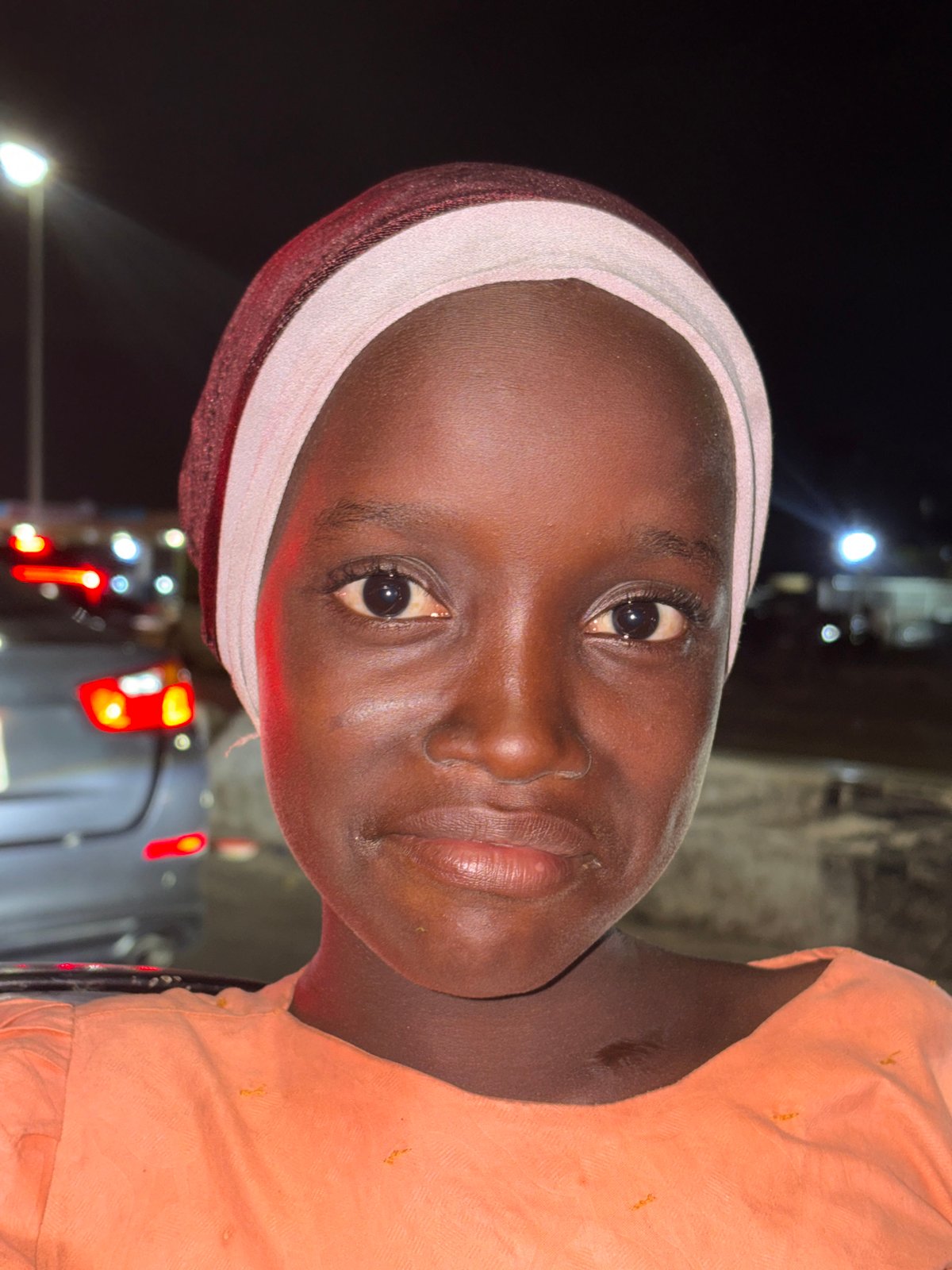 Two women photographed together in Alaguntan, Nigeria evening