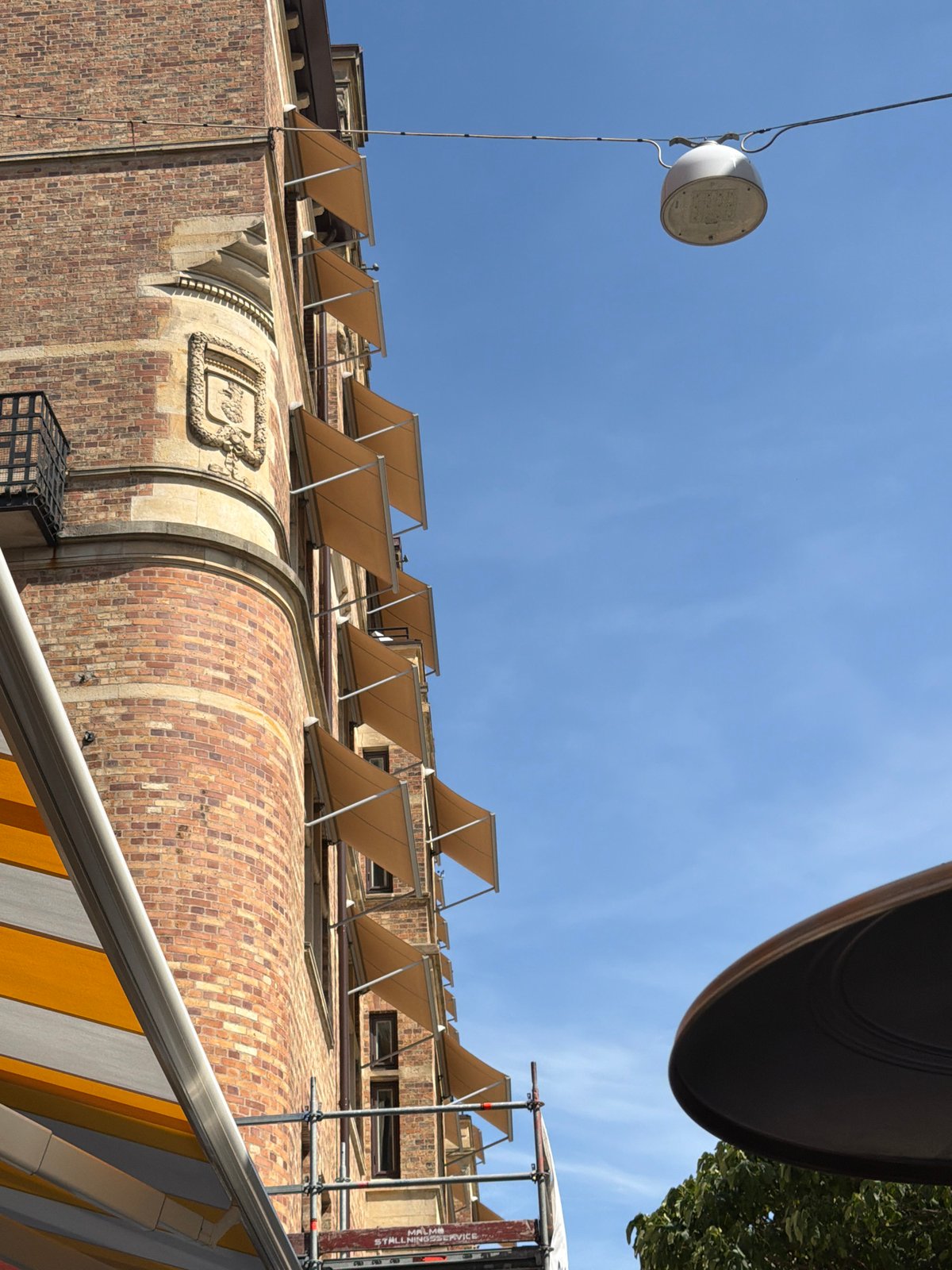 Sunny late morning at Malmö's historic city center cafés and squares