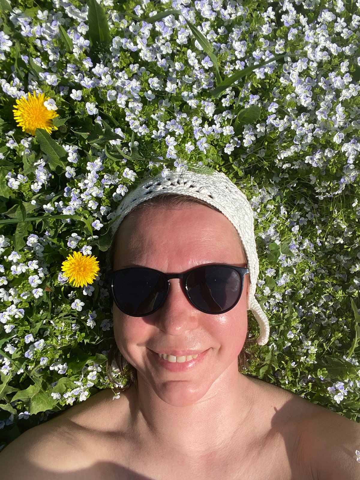 Woman enjoys spring morning in Russian wildflower field