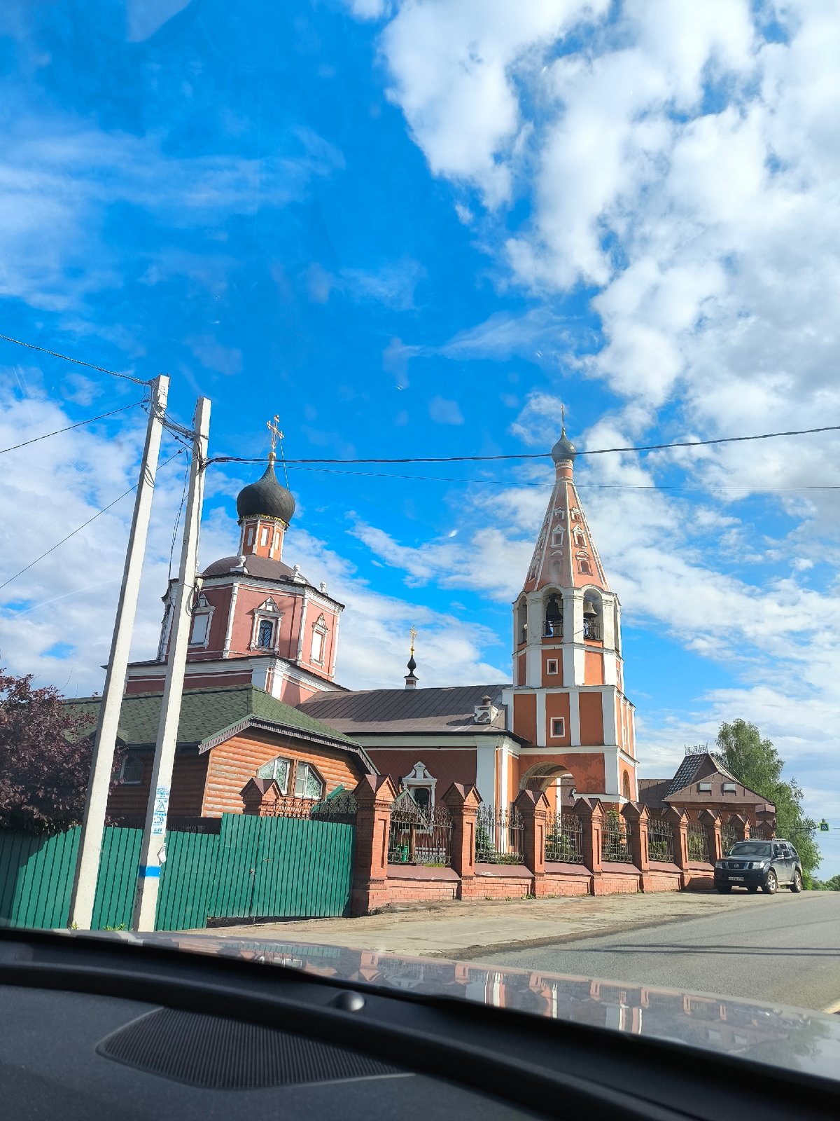 Visitors document Orthodox churches and waterfront scenery during afternoon tour