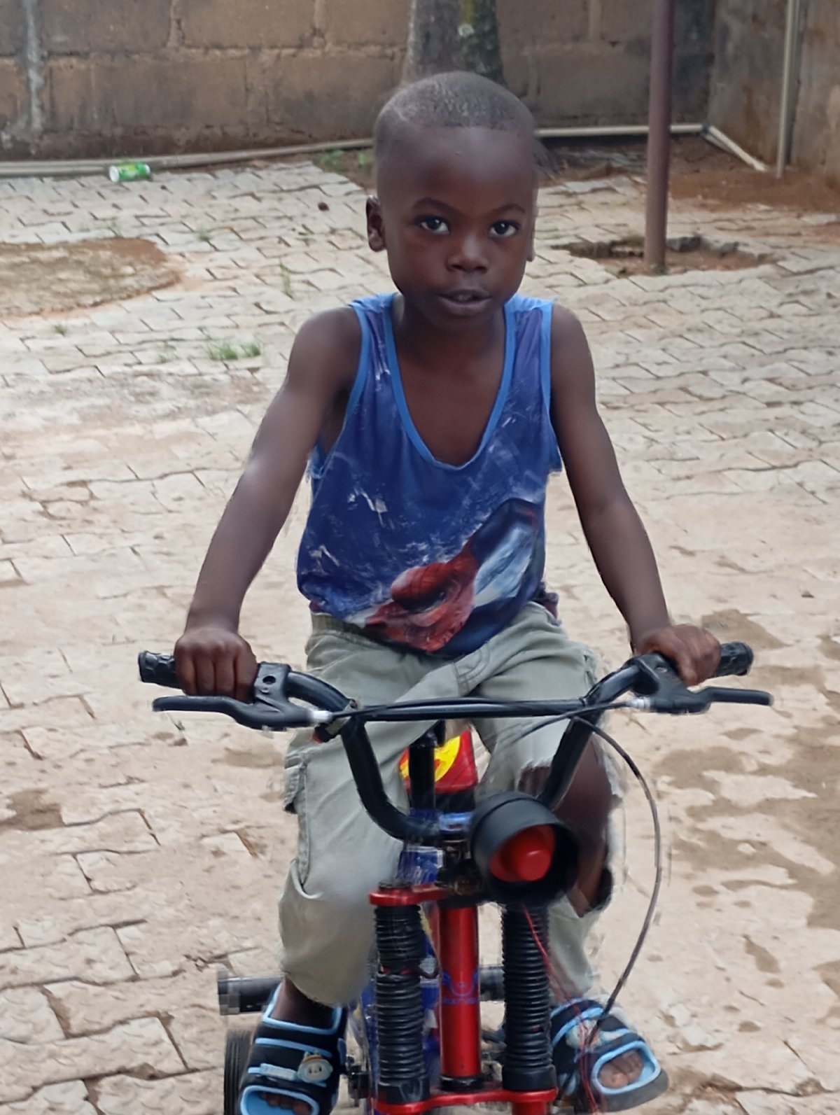 Children play with bicycles in Nigerian neighborhoods