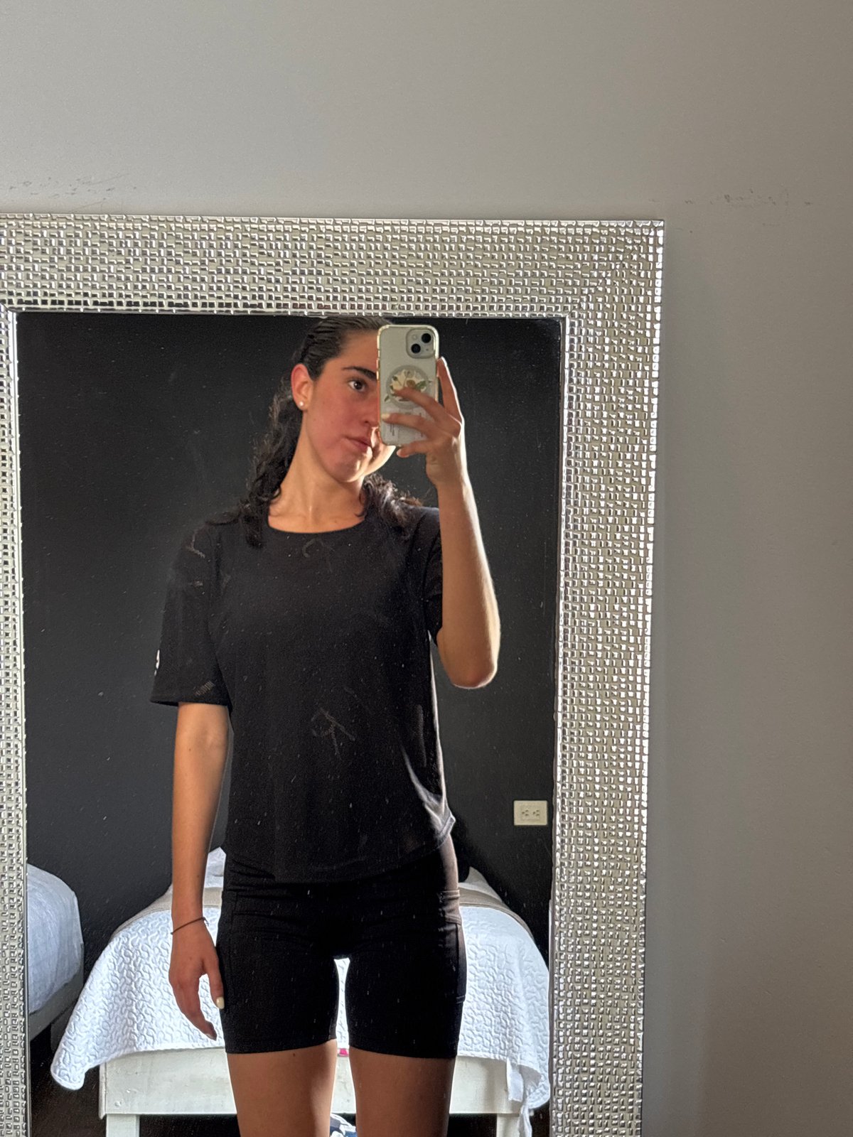 Woman takes mirror selfie in San Bernardino Tlaxcalancingo
