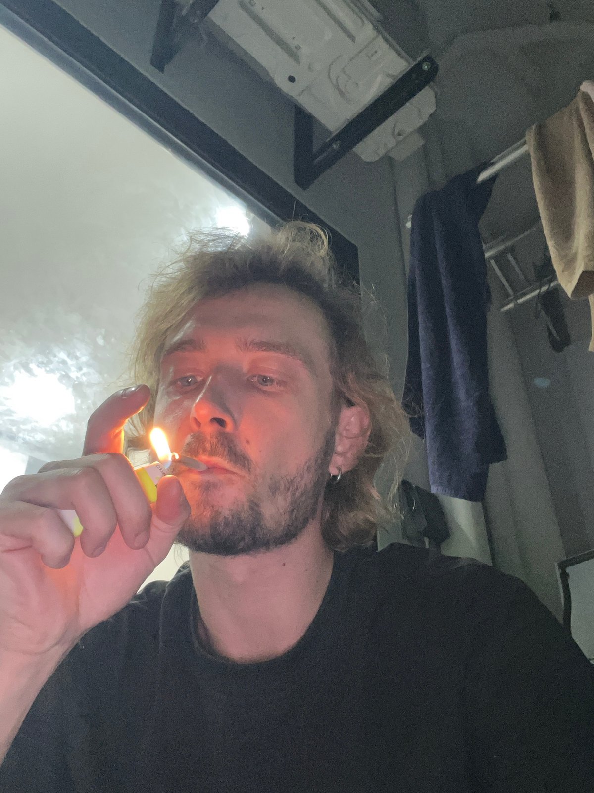 Man photographed with lit lighter at Vietnam heritage site