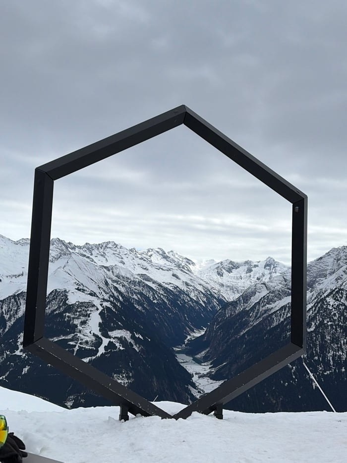 Man dines outdoors at Austrian ski resort during snowfall