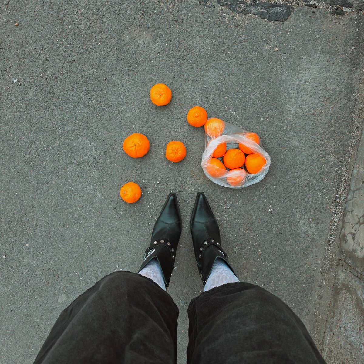 Oranges scattered from bag on Saint Petersburg street