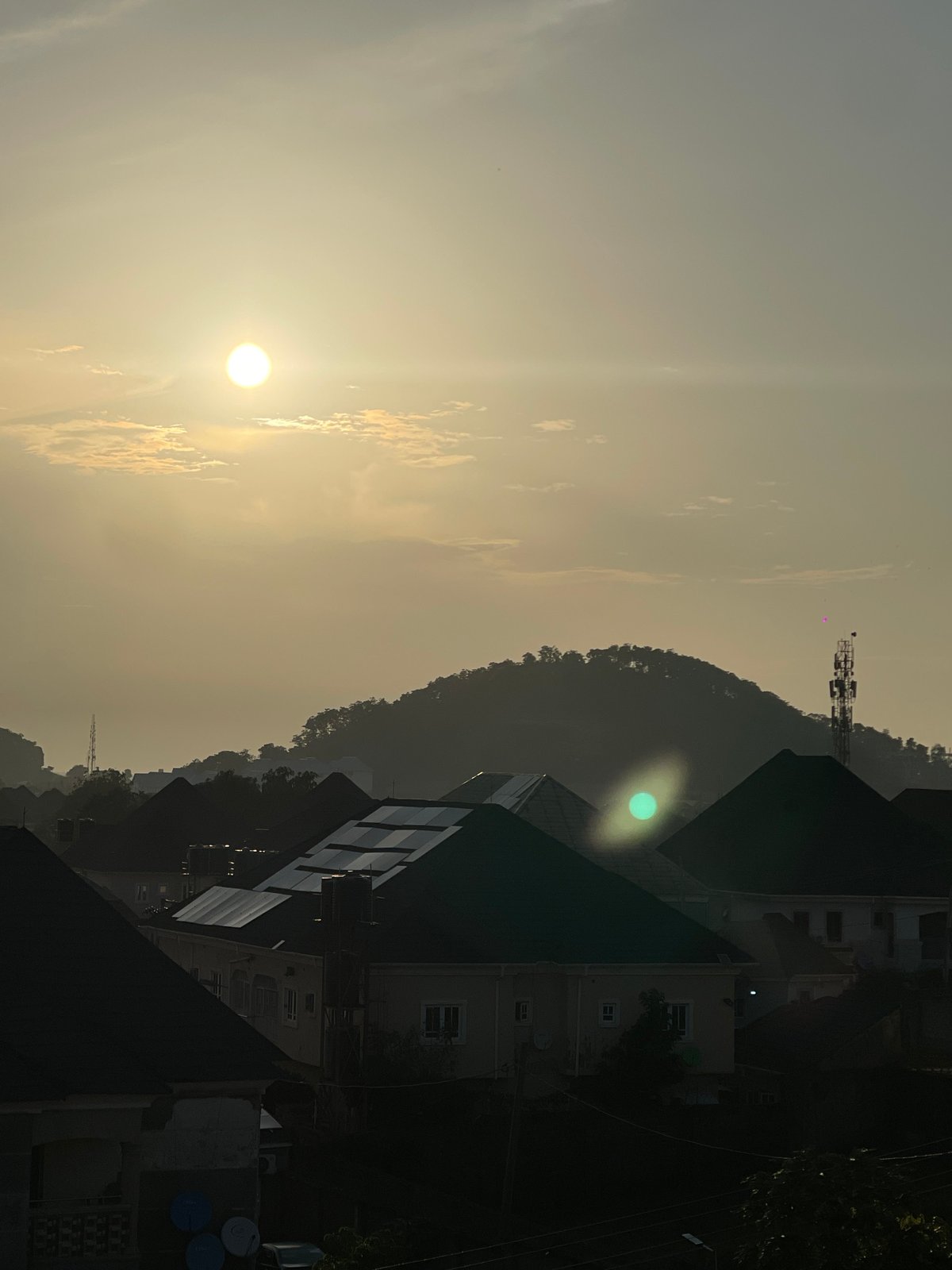 Golden hour over Abuja, from rooftops to sky