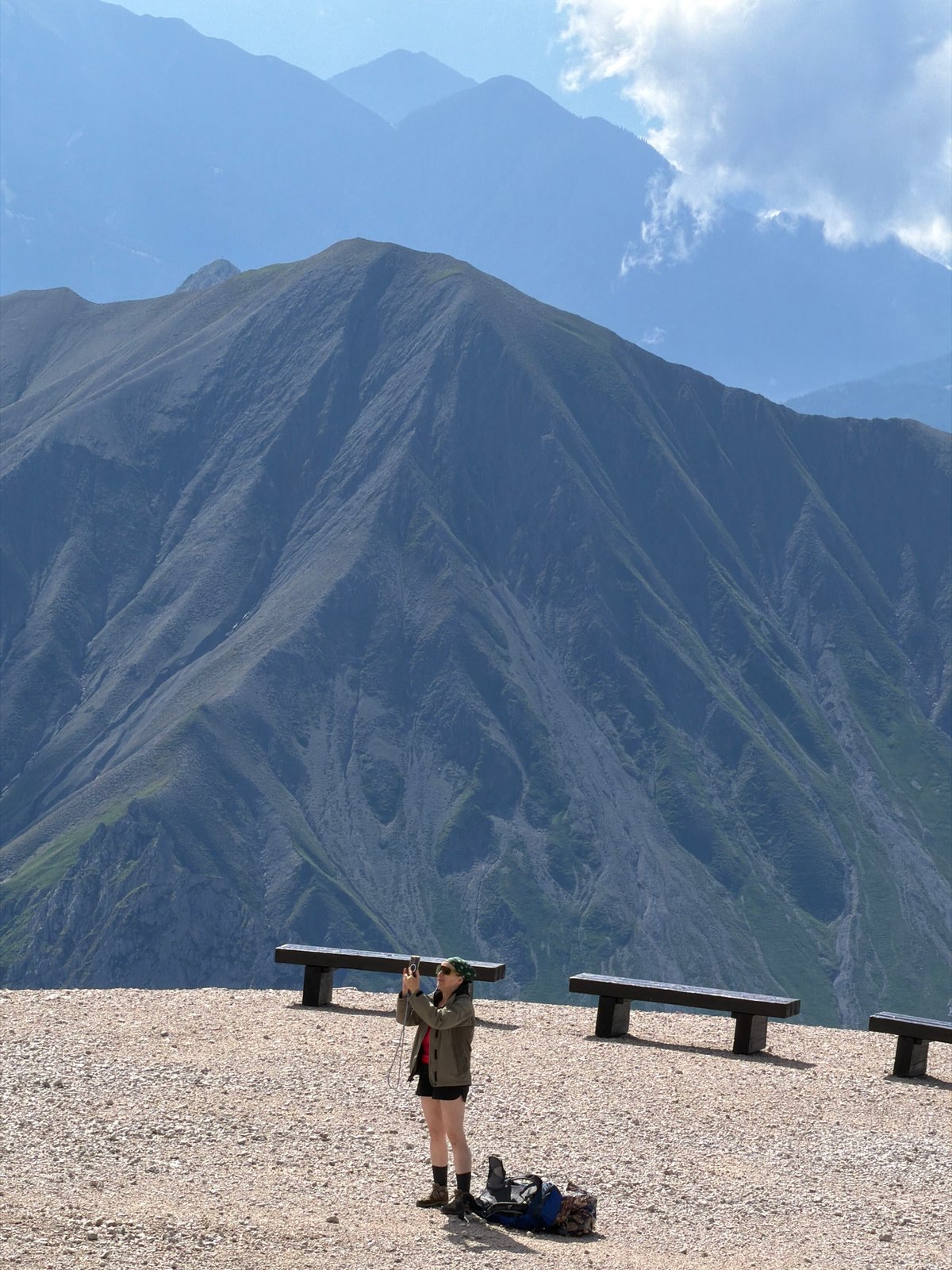 Hikers ascending a steep scree slope in the Austrian Alps
