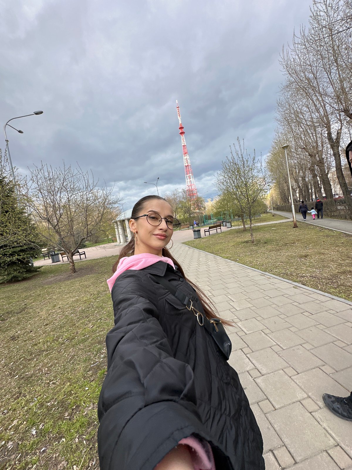 Woman photographs herself at classical monument in Yekaterinburg park