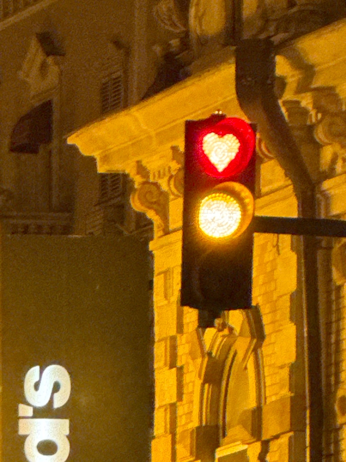 Tbilisi at night: heart-shaped traffic lights and riverside skyline