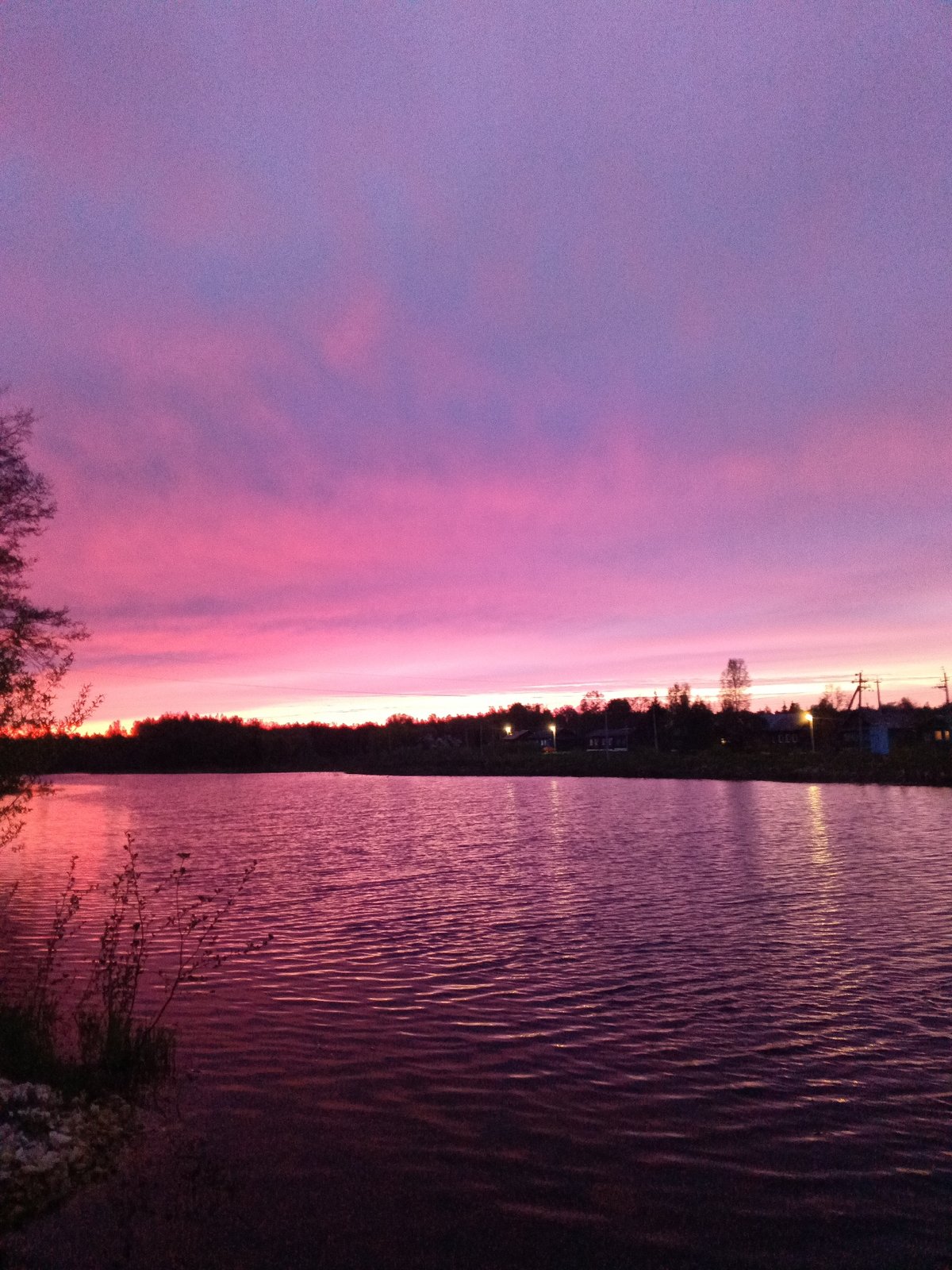 Pink and purple sunset observed over water in Красный Маяк