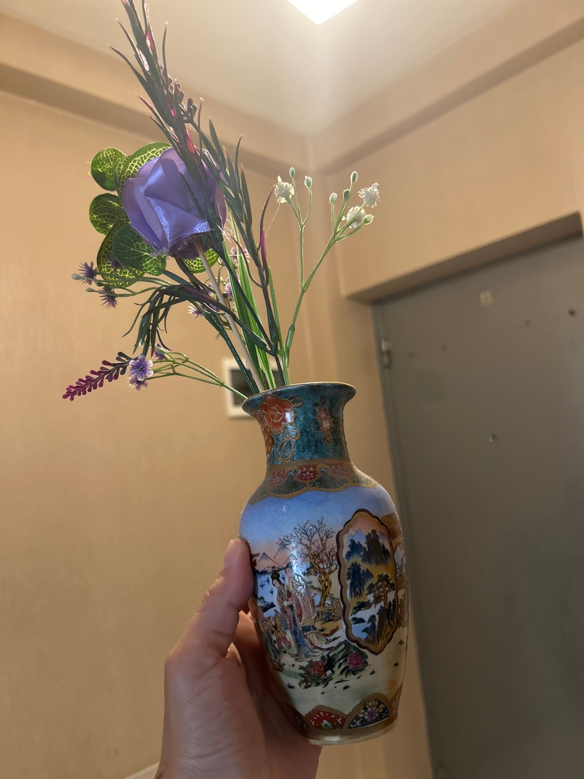 Person Documents Art Collection and Decorative Objects Over Morning Hours