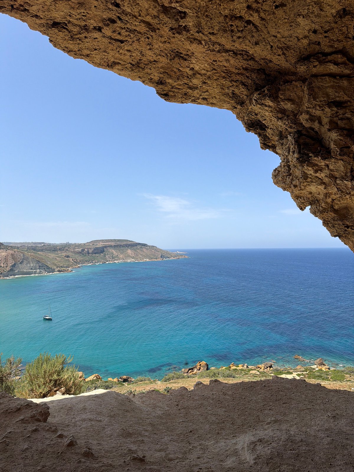 Coastal view captured from rock cave in Xagħra, Malta