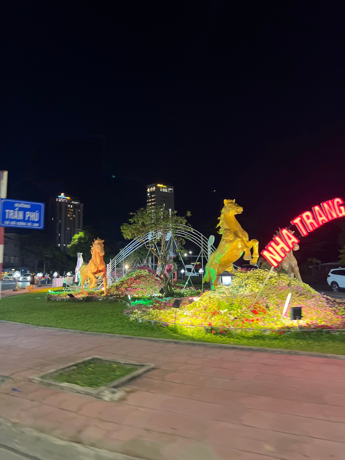 Golden horse street art installation illuminated in Nha Trang