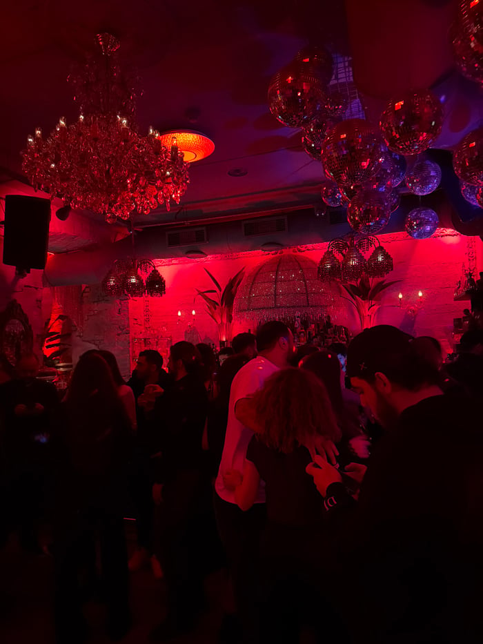 Evening nightclub gathering in Yerevan features dining and DJ entertainment