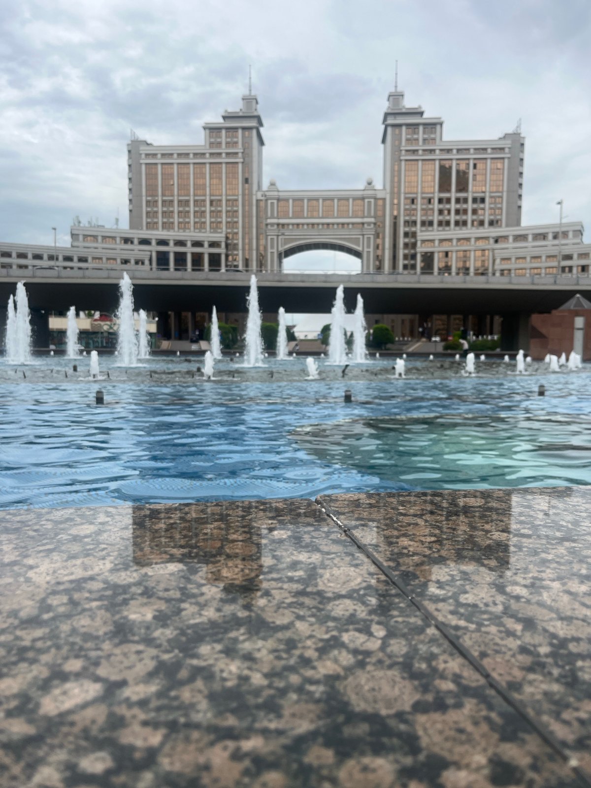 Strolling Astana's Bayterek plaza: fountains, bronze sculptures, landmark architecture