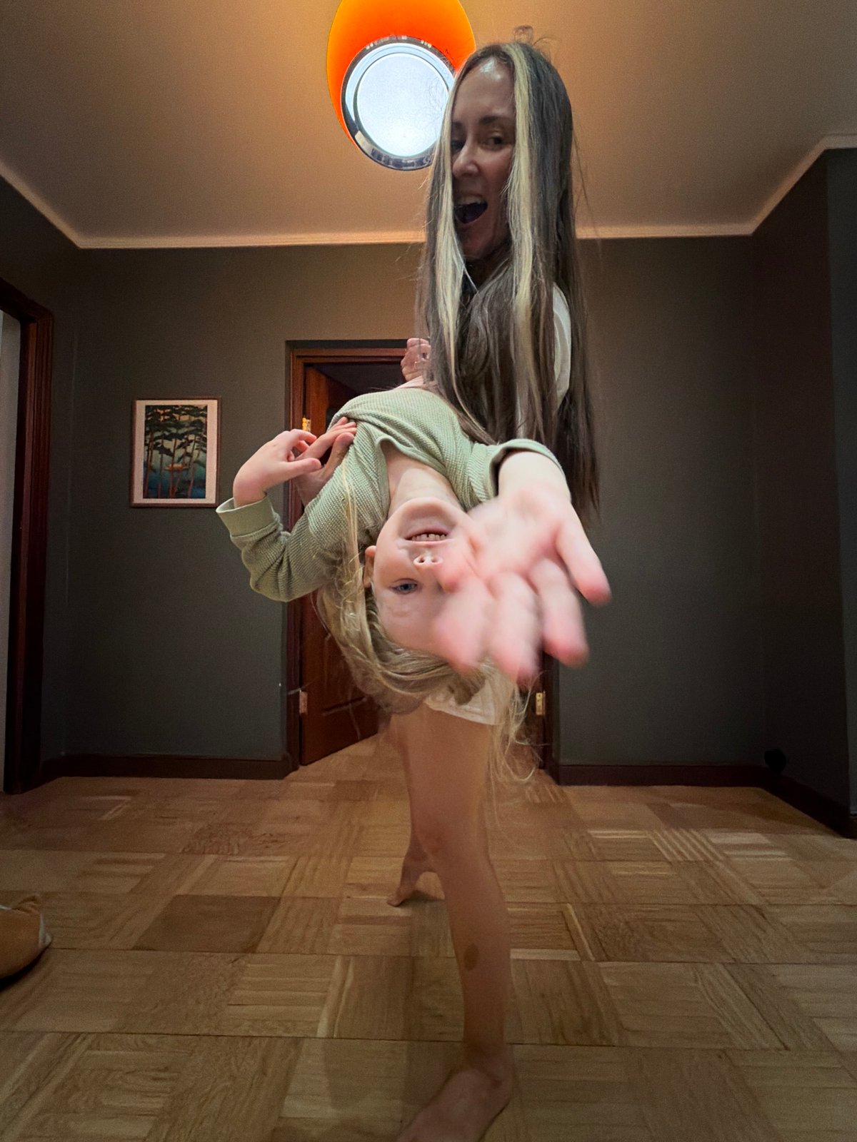 Woman and child play indoors in Khimki home