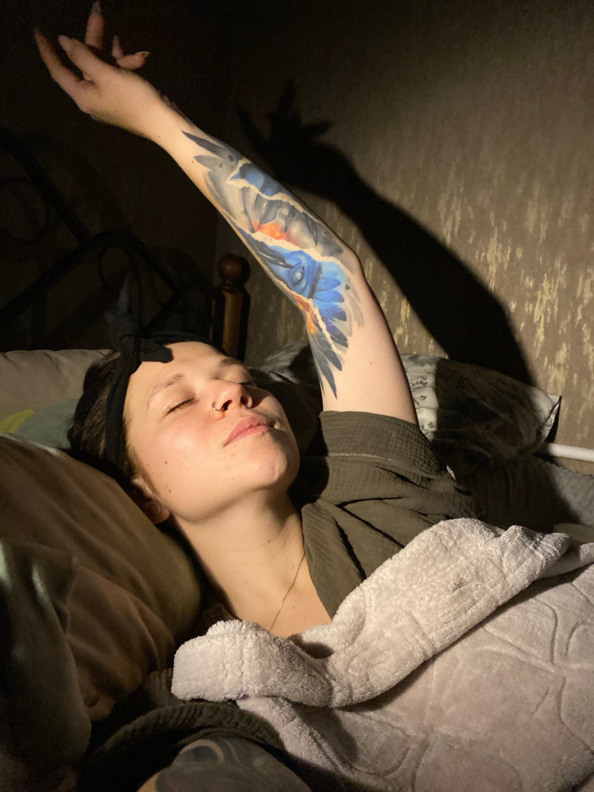 Person reads Russian book in bed in Chaikovsky