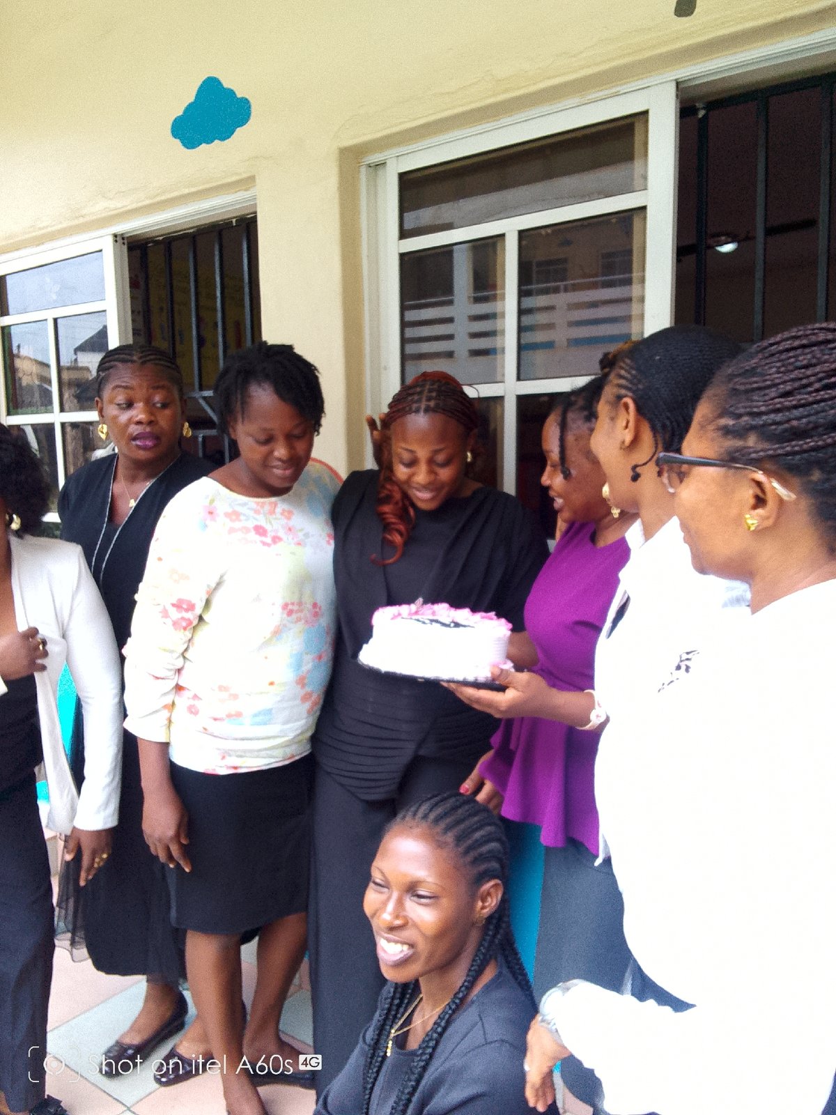 Women celebrate birthday with cake at Nigerian school