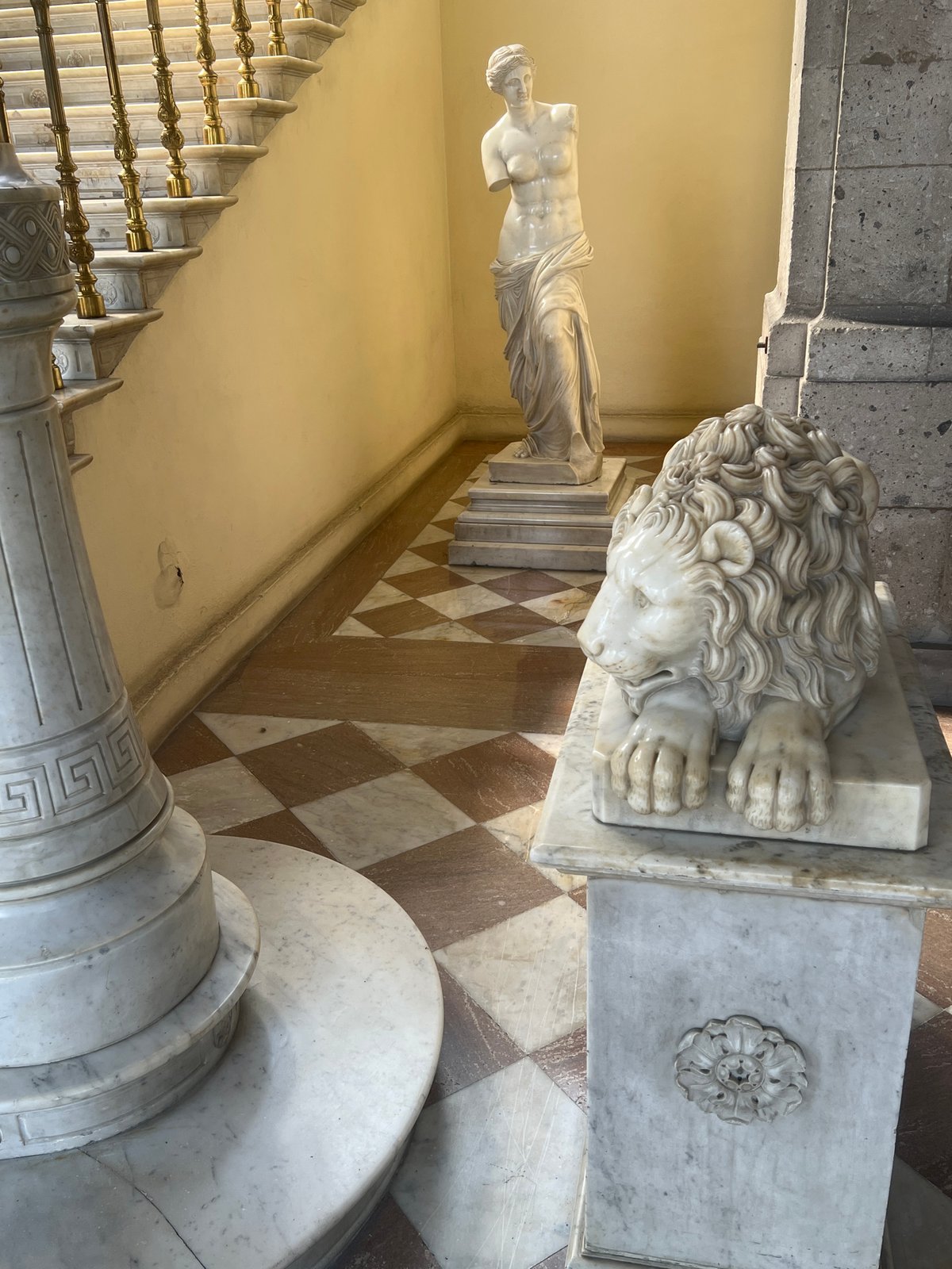 Visitor documents ornate interior features at Mexico City cultural site