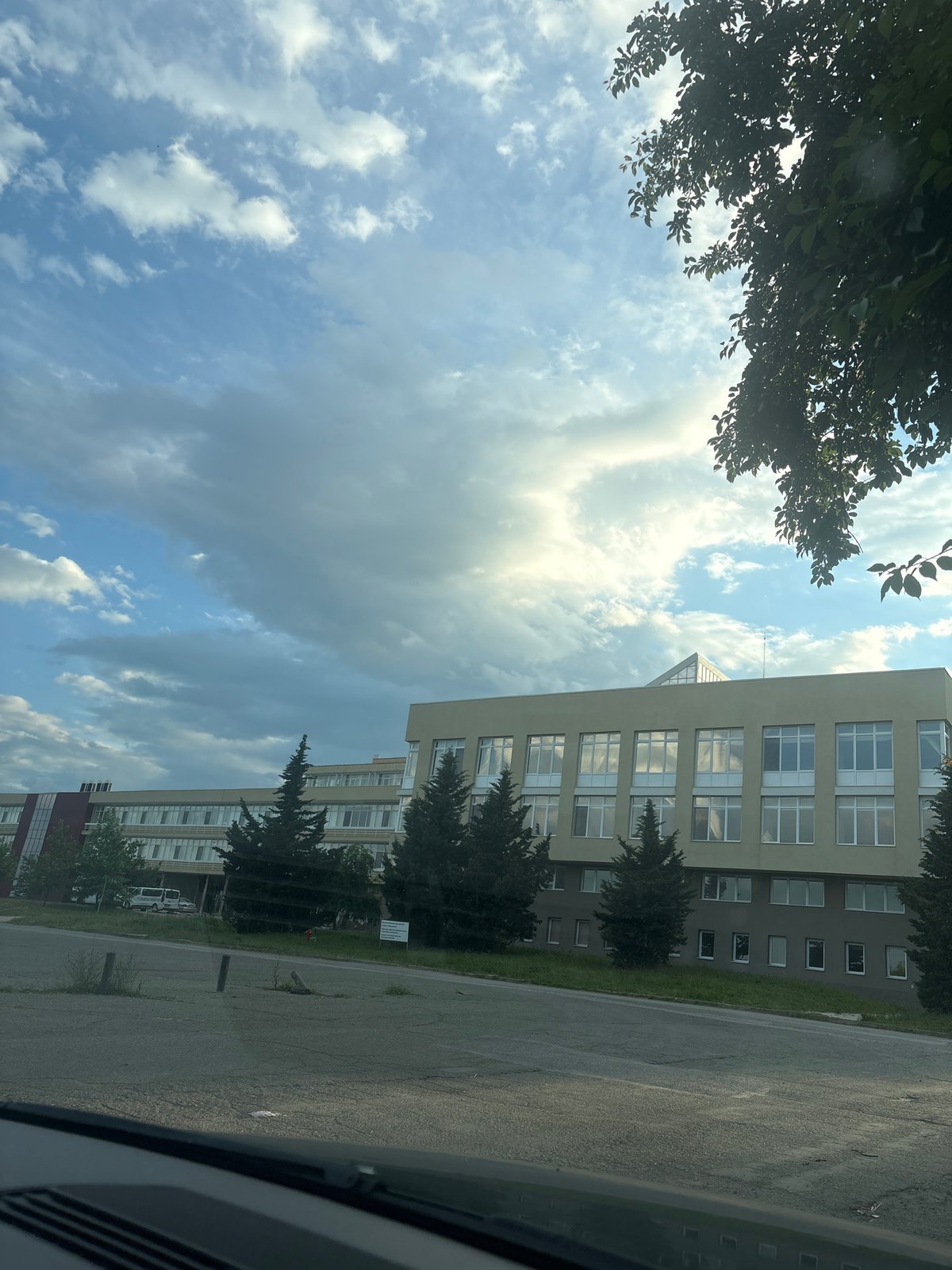 Multi-story building photographed under blue skies in Stara Zagora