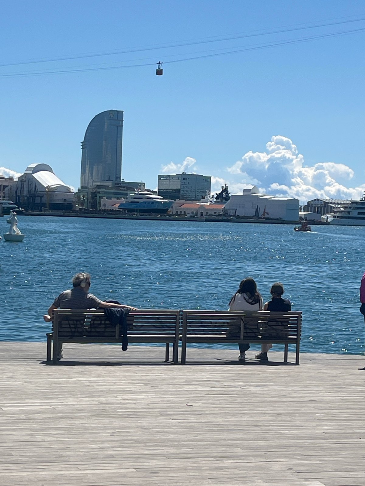 Barcelona waterfront draws morning visitors under clear skies