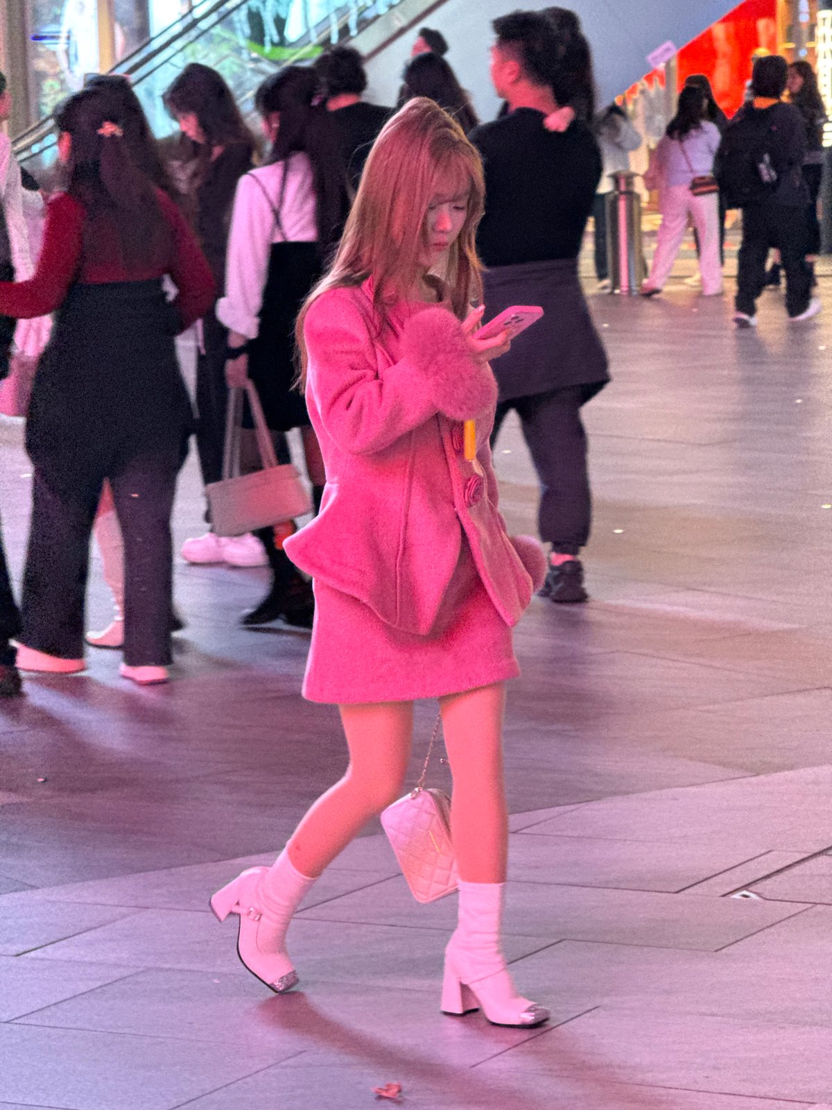 Evening pedestrian activity captured in urban Liangjiang district