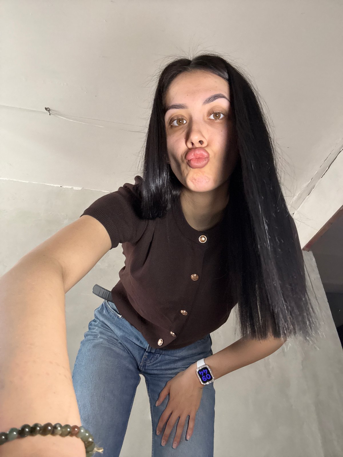 Woman takes indoor selfies in Votkinsk, Russia early morning
