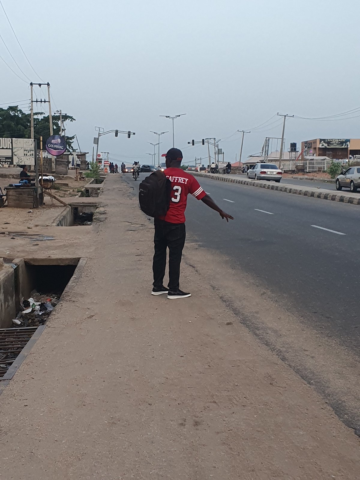 Daily street life documented across Lokoja, Nigeria during evening hours