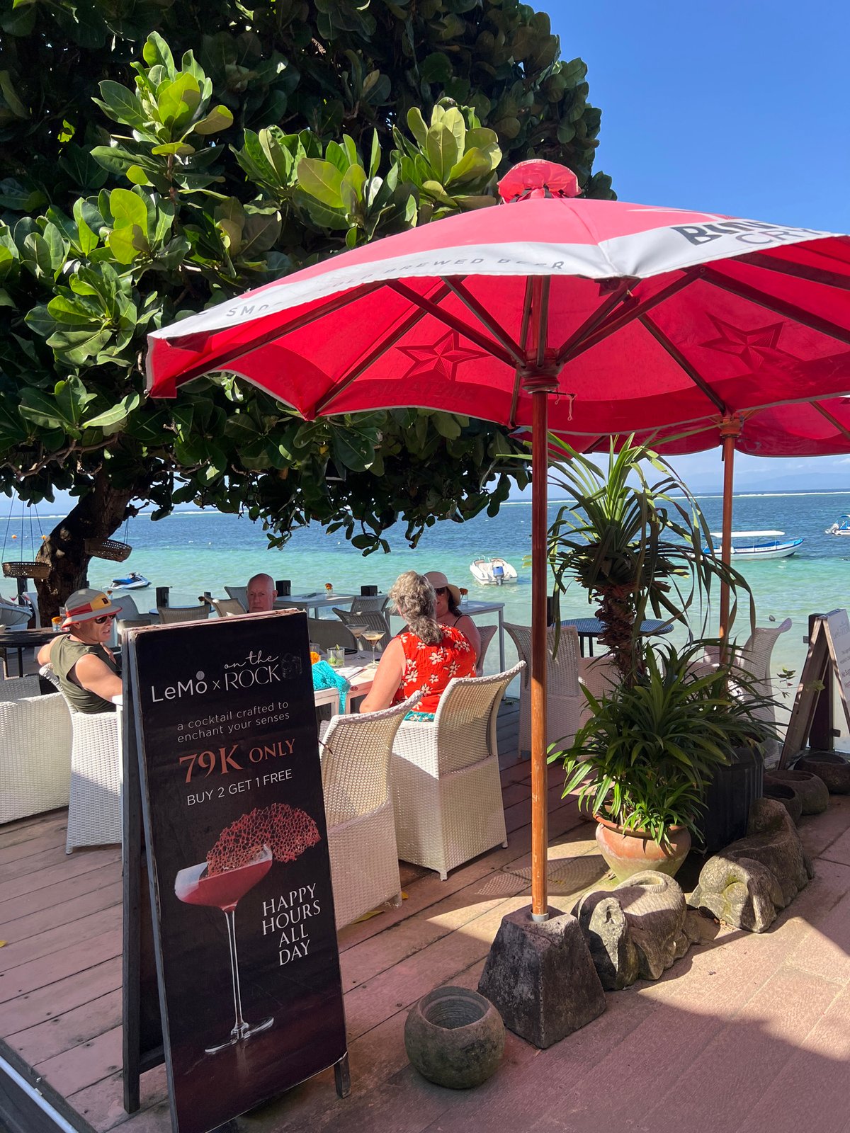 Casual beach morning in Denpasar — water sports, food, and shoreline life