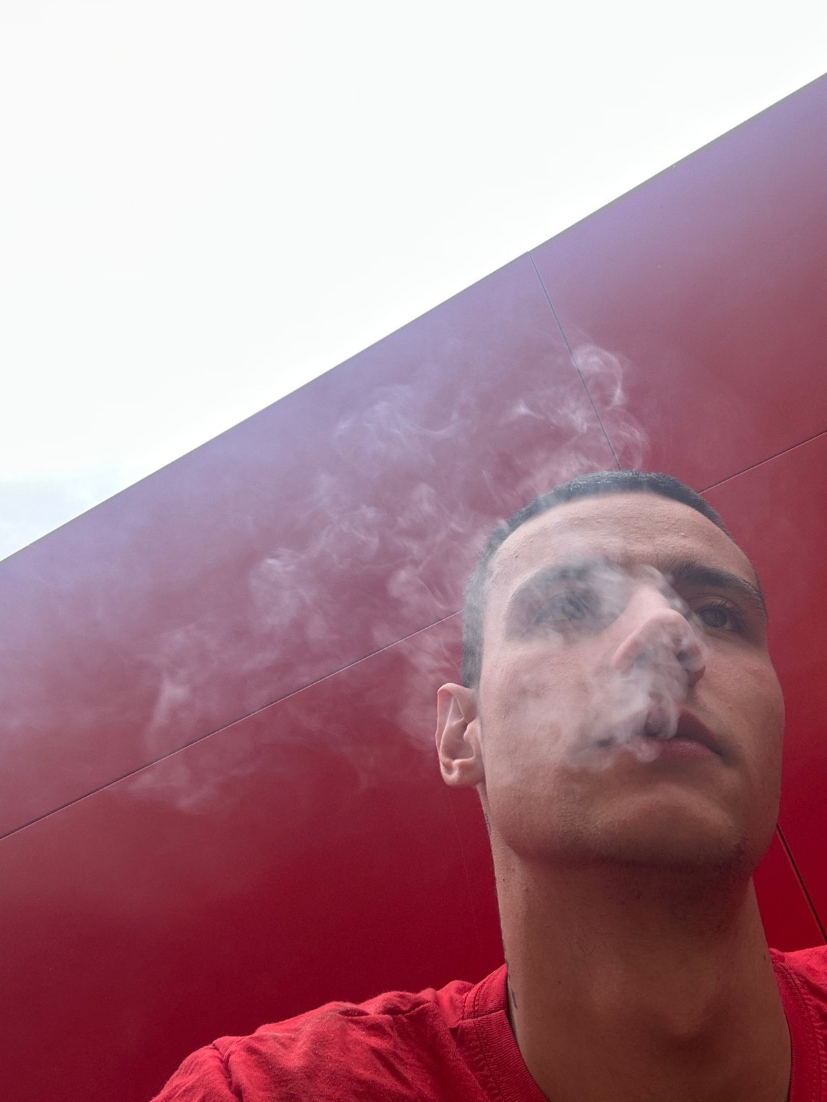 Man smoking photographed in Sofia with artistic background