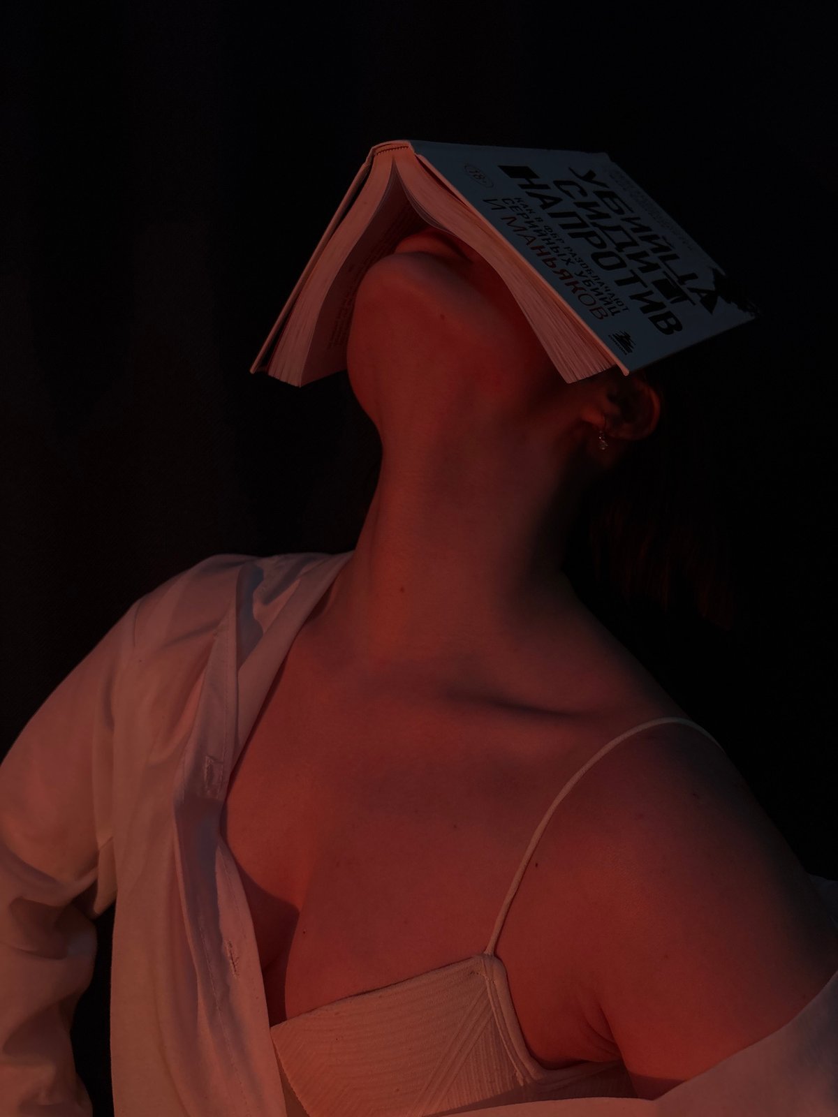 Reader rests with crime novel in Chaikovsky, Russia