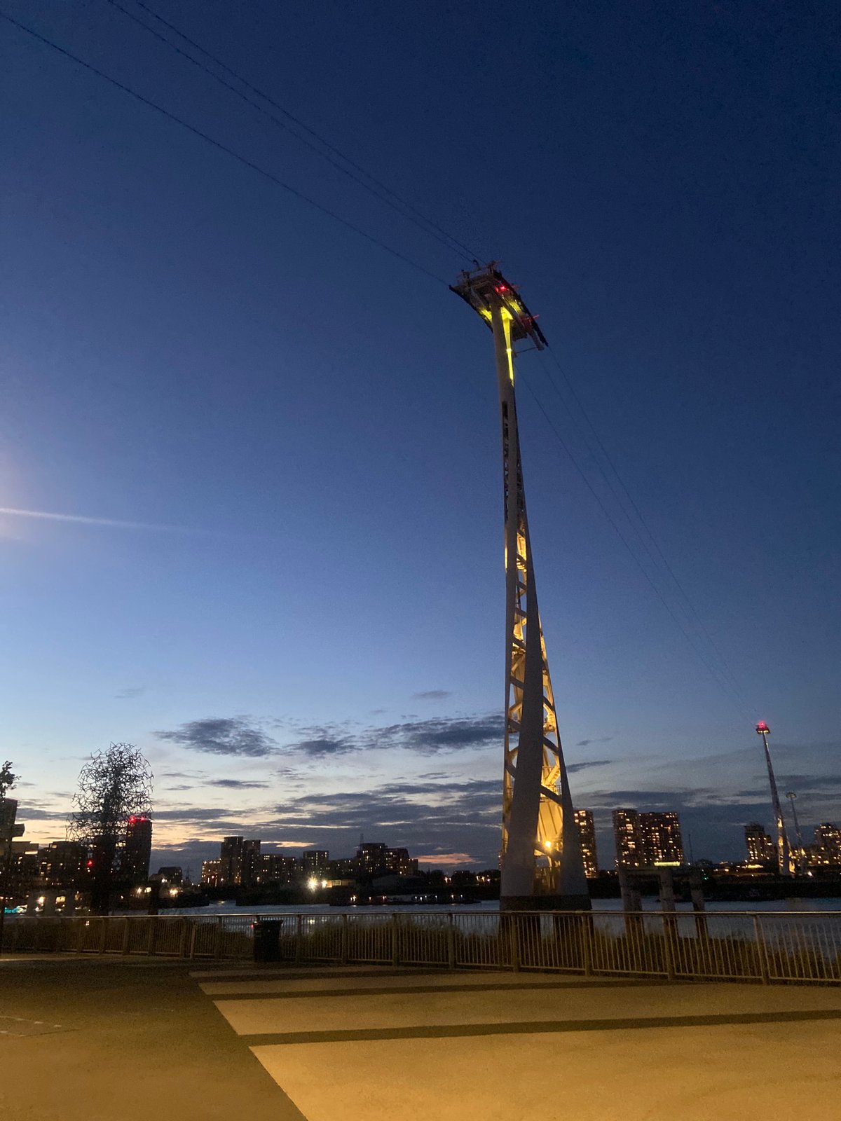 Dusk along the Thames: cable cars, skyline, and street-level East London