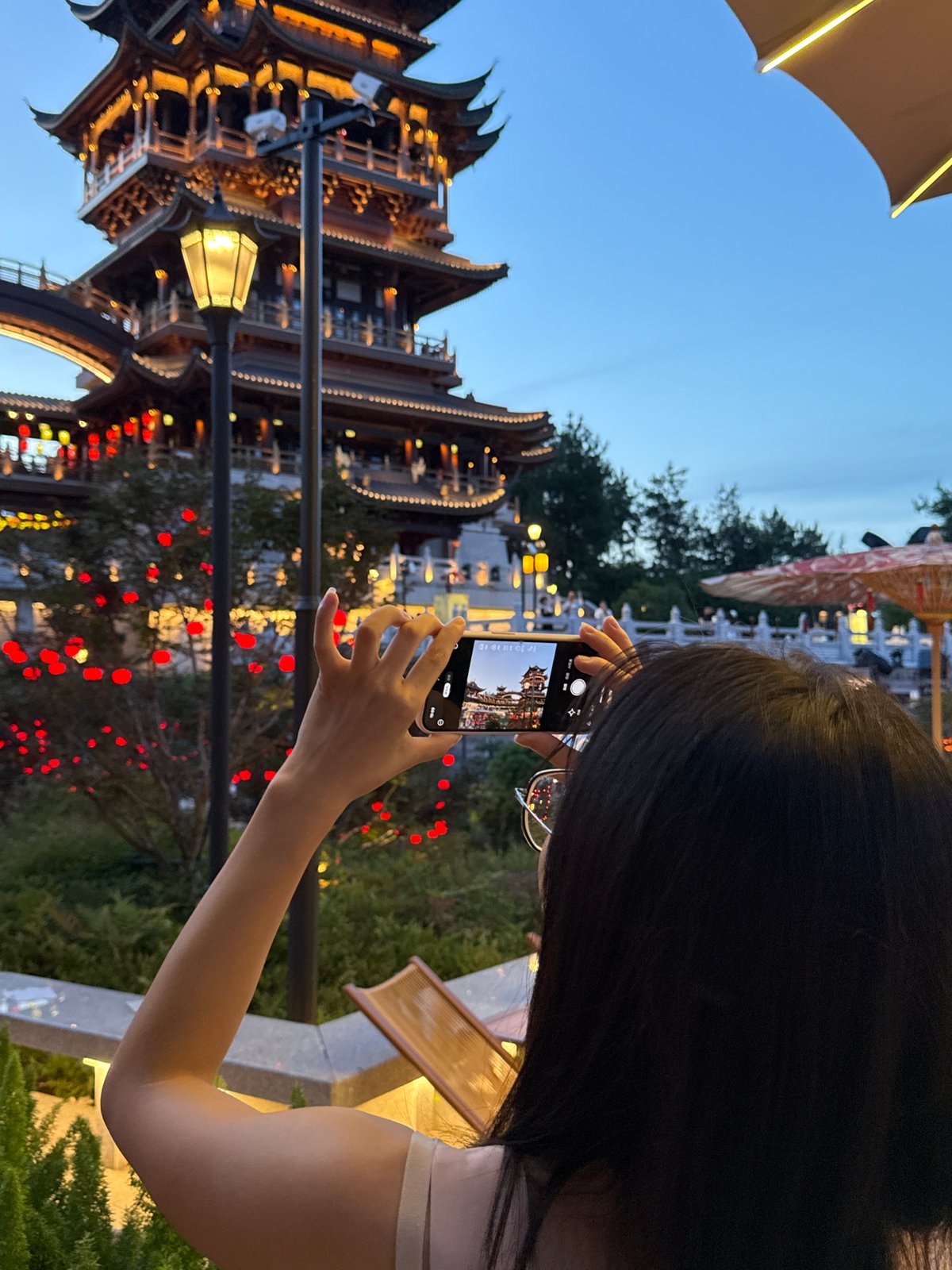 Lanterns and traditional architecture light up a Yiwu festival evening