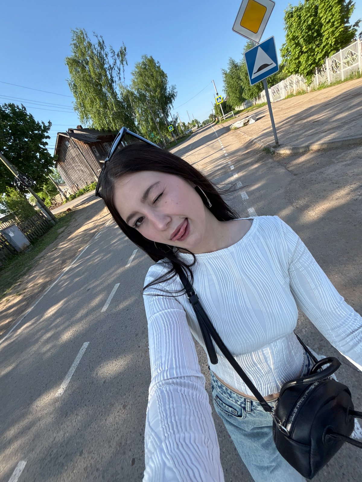 Woman takes selfie on street in Фоки, Russia