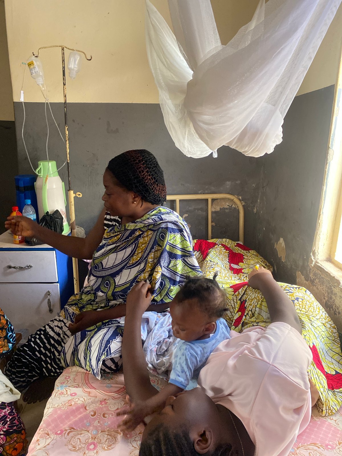 Women care for baby in Nigerian medical facility