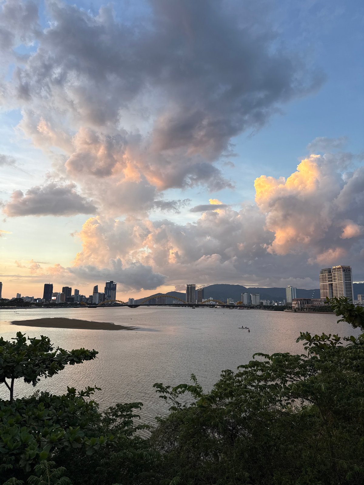 Dramatic sunset illuminates Đà Nẵng waterfront and cityscape