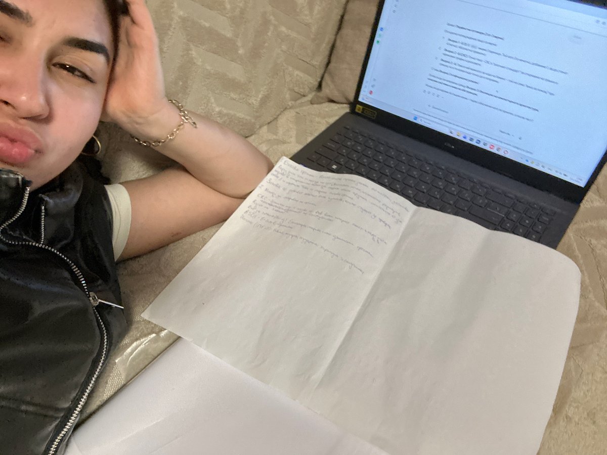 Person rests with laptop and papers in Burgas