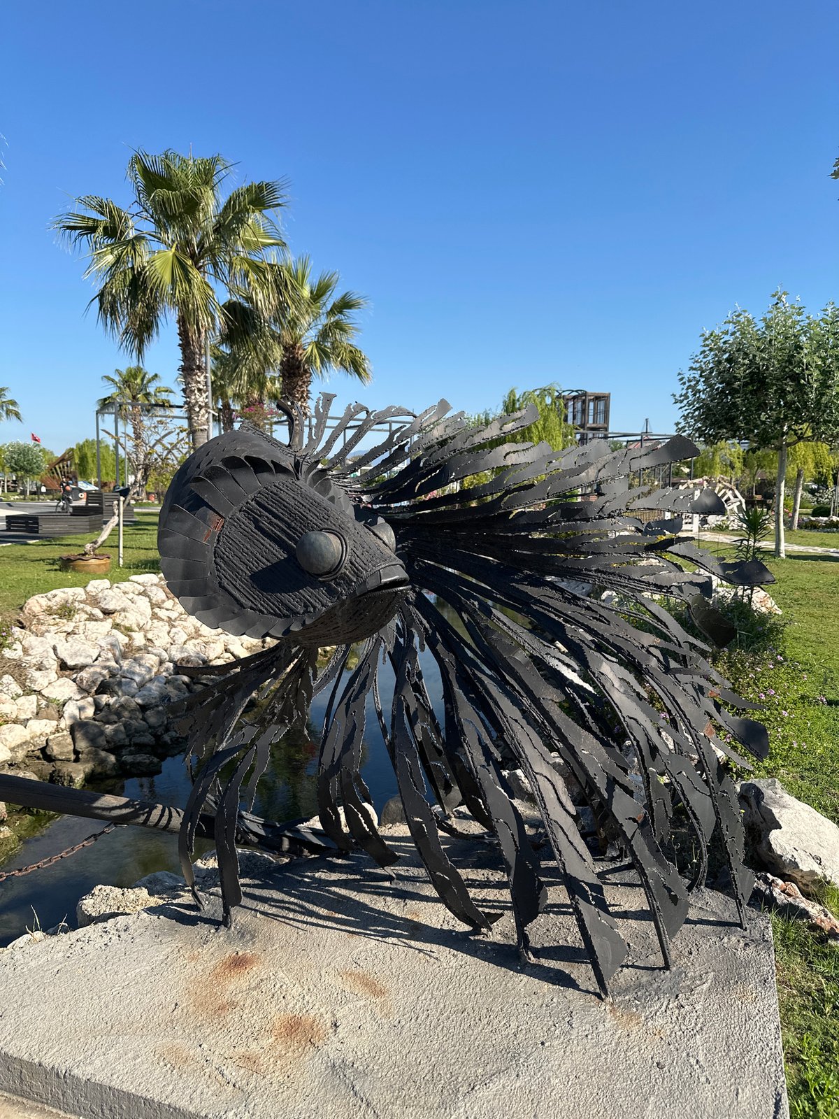 Woman captures morning stroll with stroller in Fethiye park