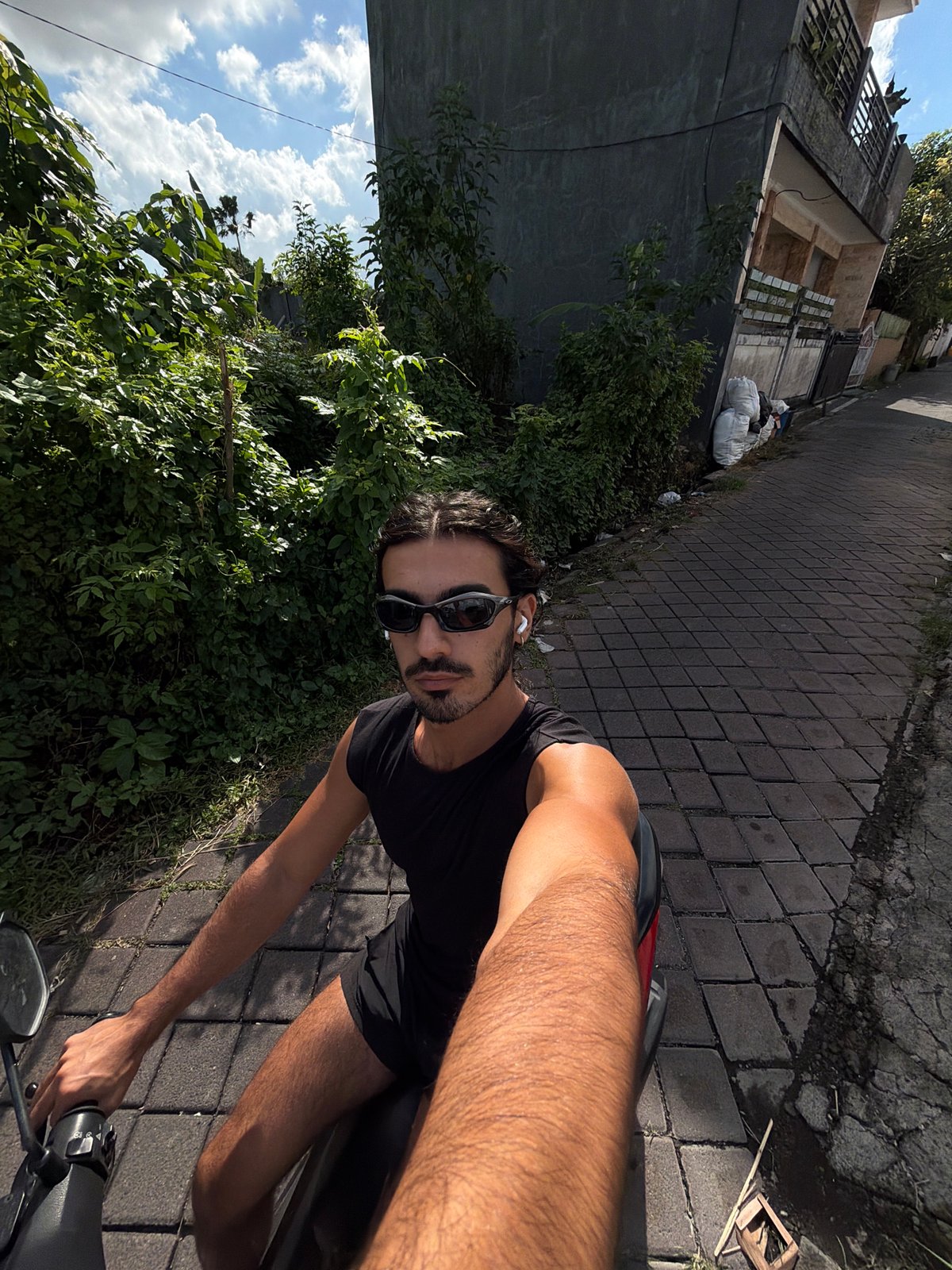 Motorcyclist Takes Selfies While Riding in North Kuta