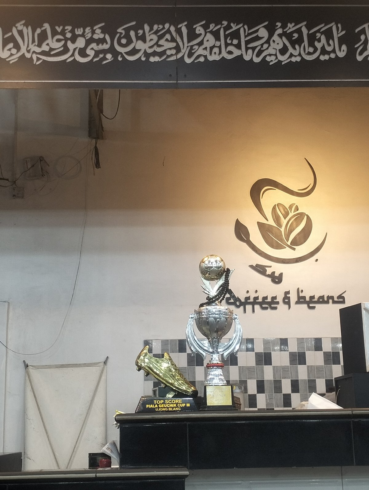 Coffee shop displays soccer trophies in Lhokseumawe, Indonesia