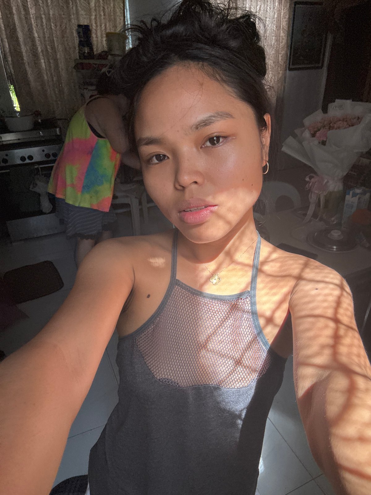 Quiet domestic morning in Davao: cats, laundry, flowers, and selfies