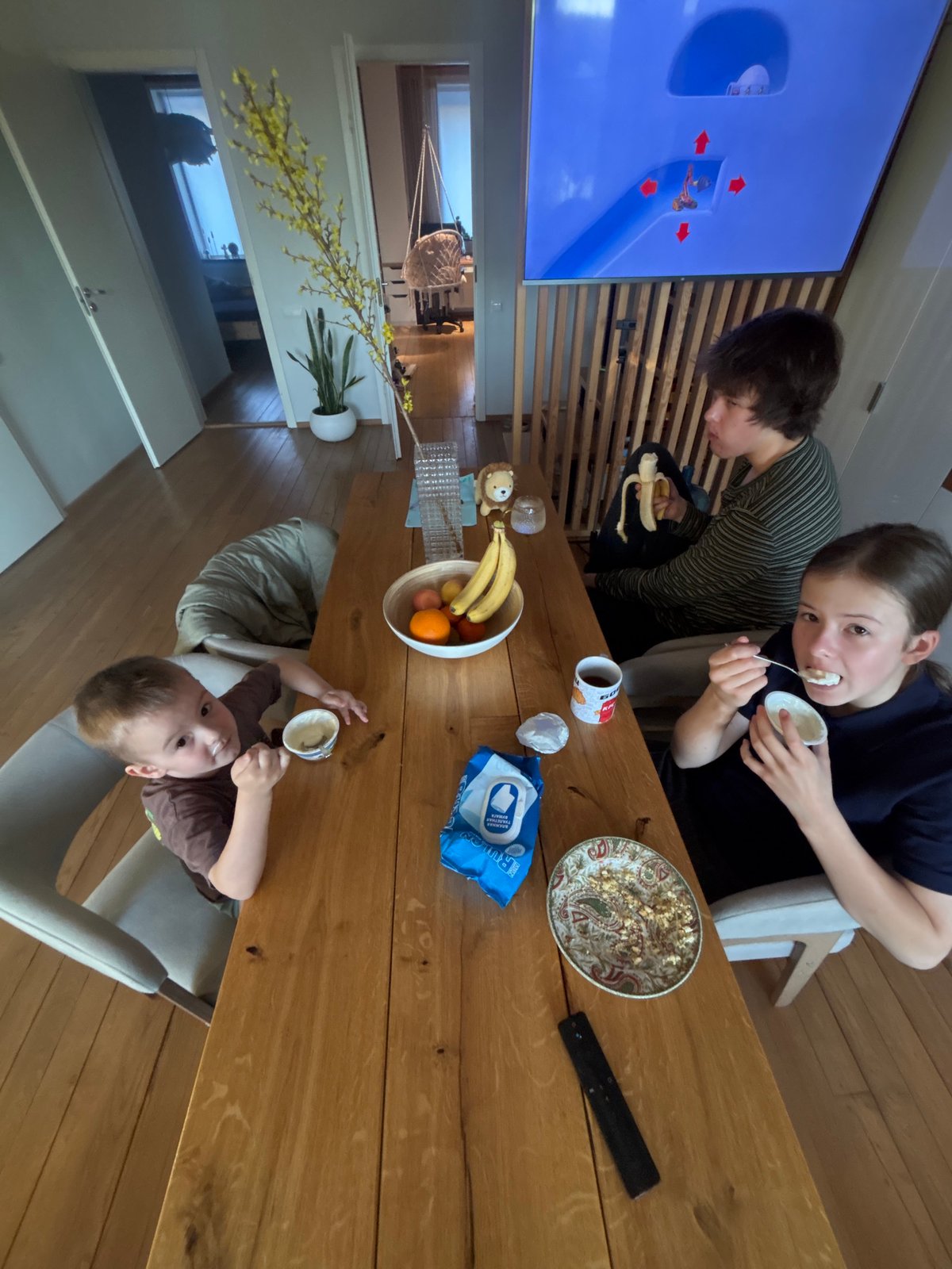 Children share meal at table in Chaikovsky, Russia