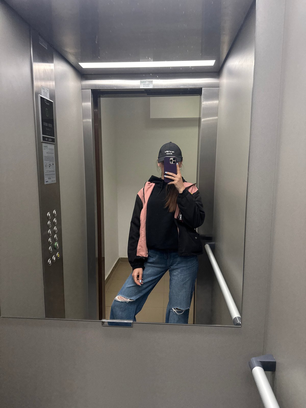 Person documented in elevator and building exterior in Plovdiv