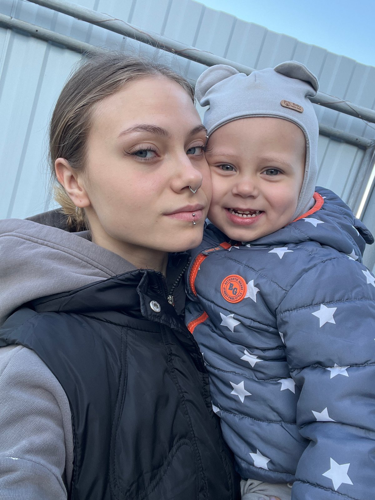 Woman and child take selfie in Russian town
