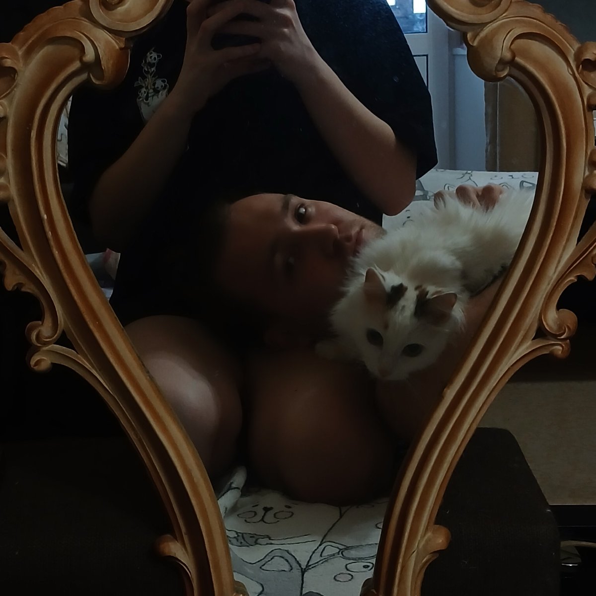 Indoor selfie session captured in ornate mirror, Yekaterinburg