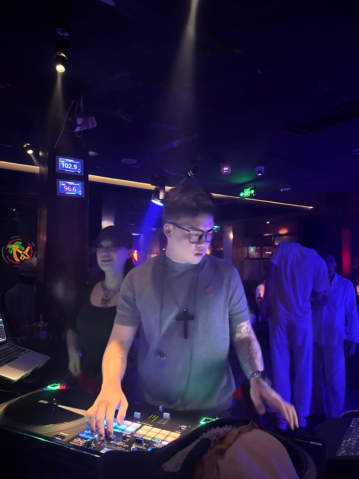DJ set at Liangjiang nightclub with dancing crowd