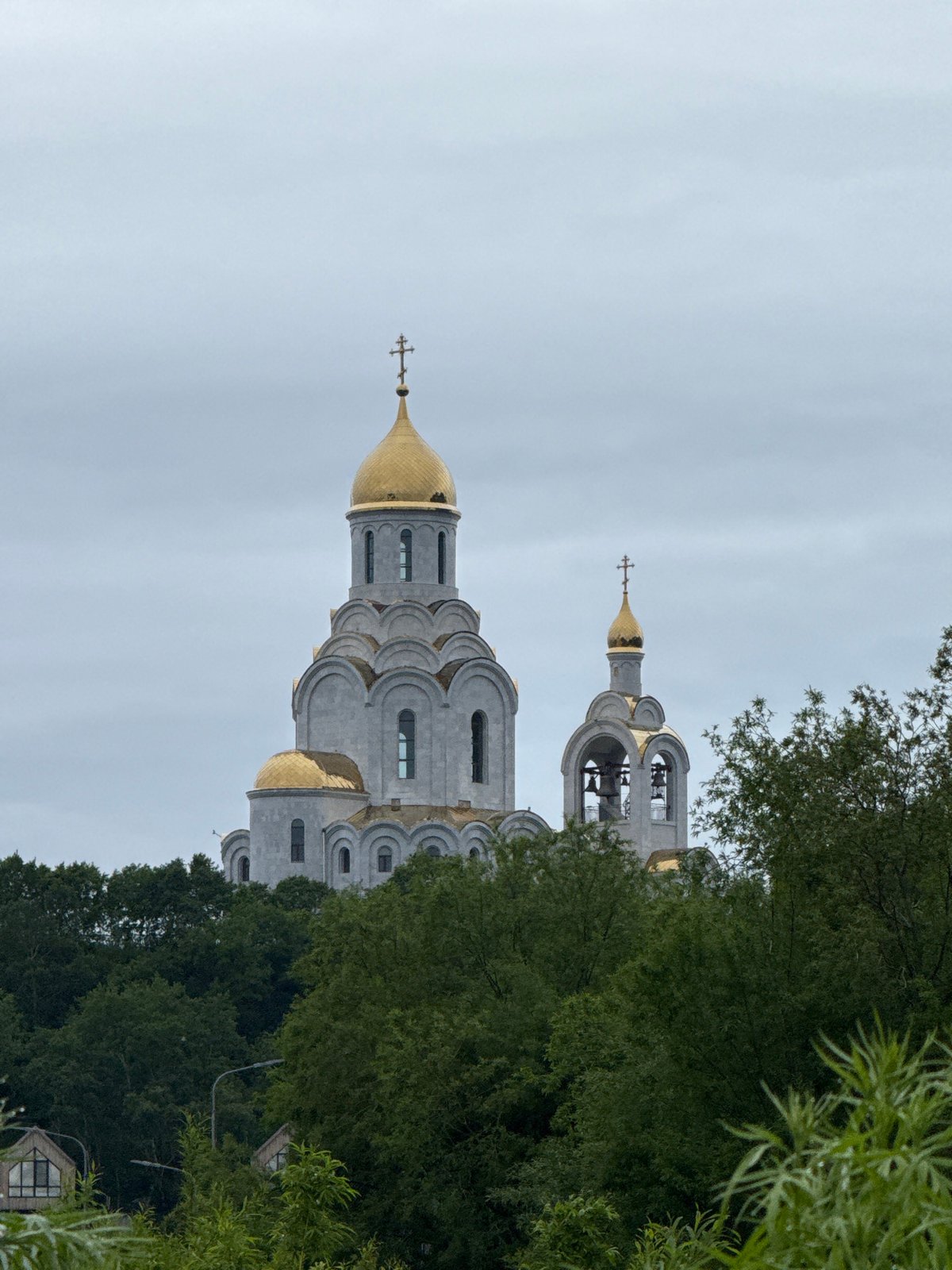 Orthodox church with golden domes on a hill in Kamchatka