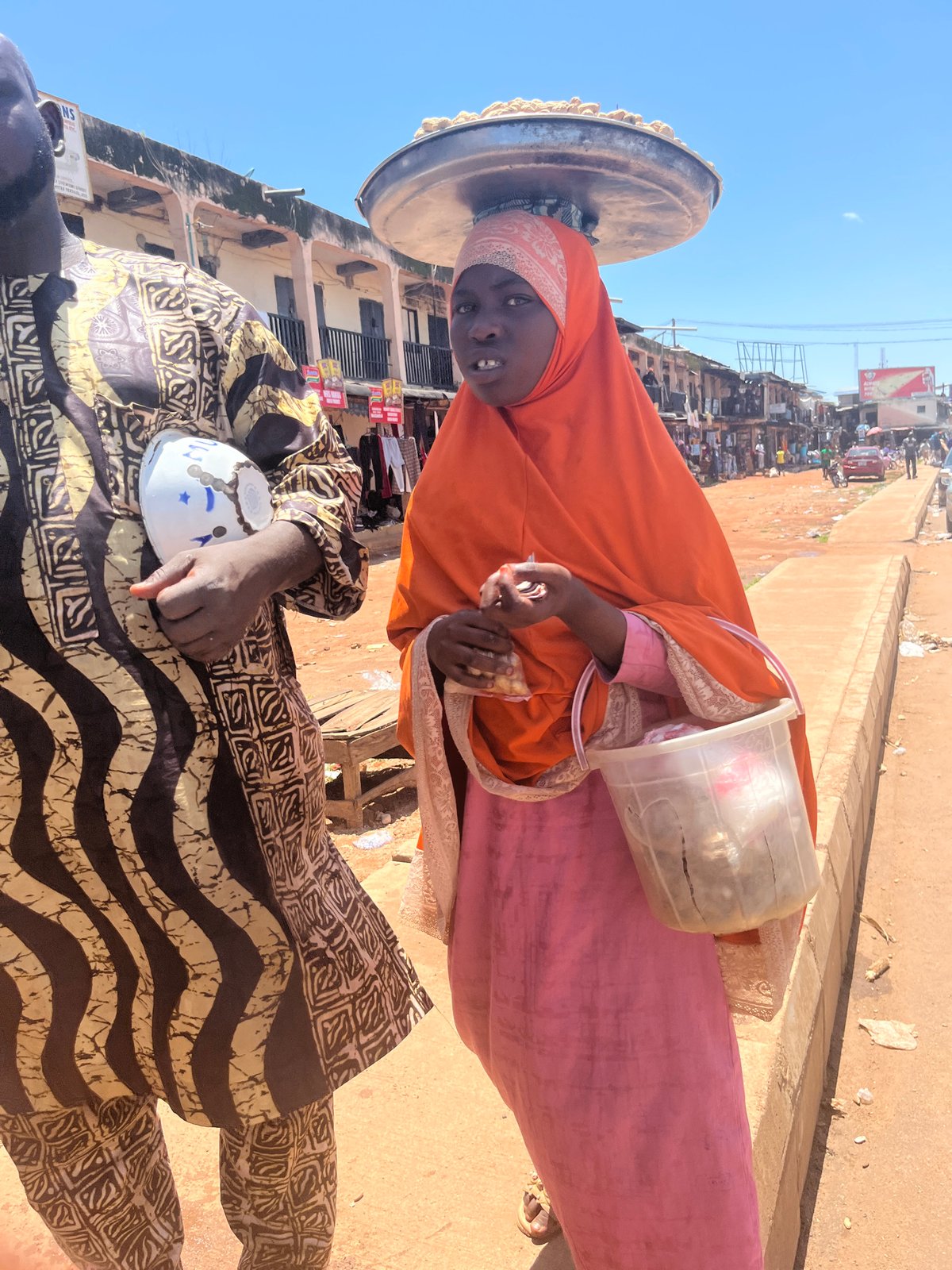 Street life in Jos, Nigeria on a busy market morning