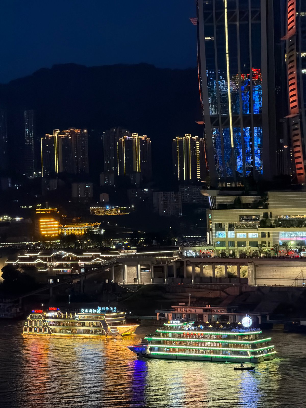 Chongqing's neon-lit waterfront and streets after dark