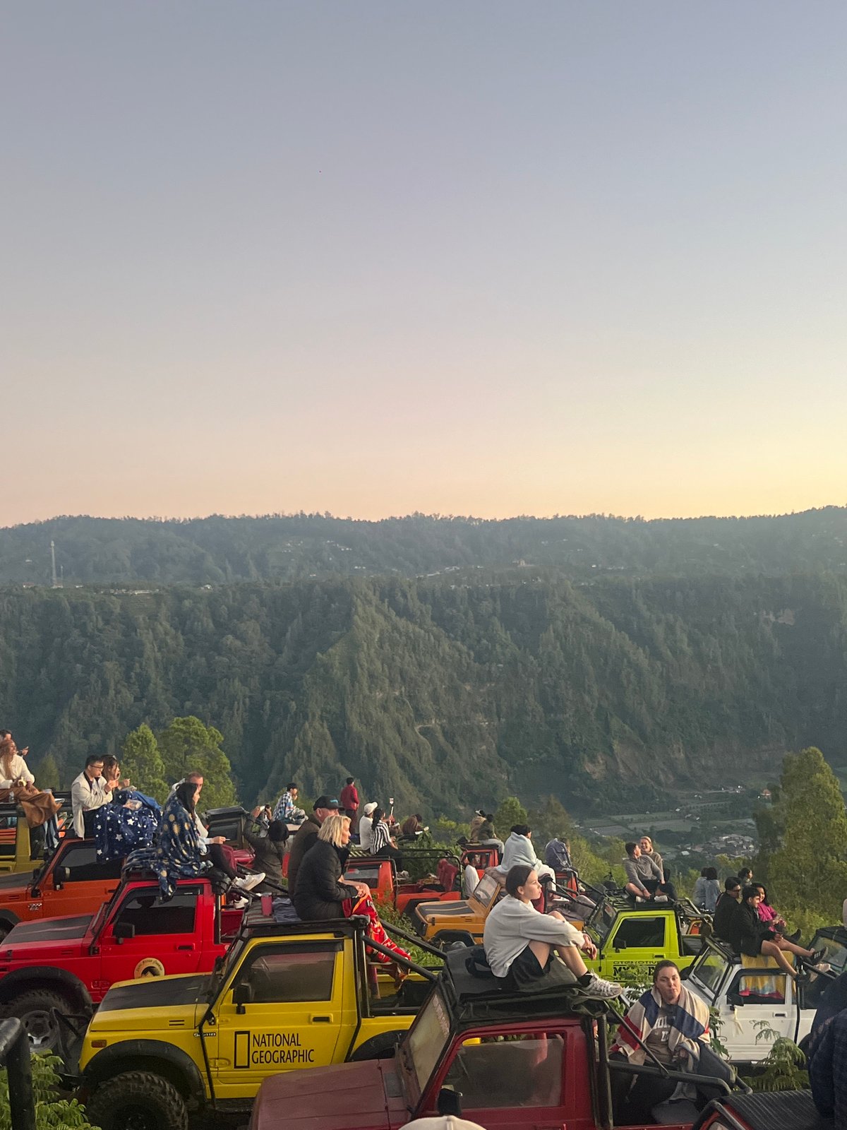 Sunset from jeep rooftops over Kintamani's volcanic valley